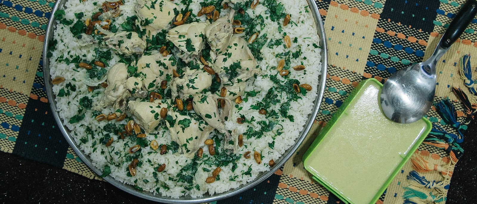 A tray of mansaf: rice, lamb and parsley, made for sharing
