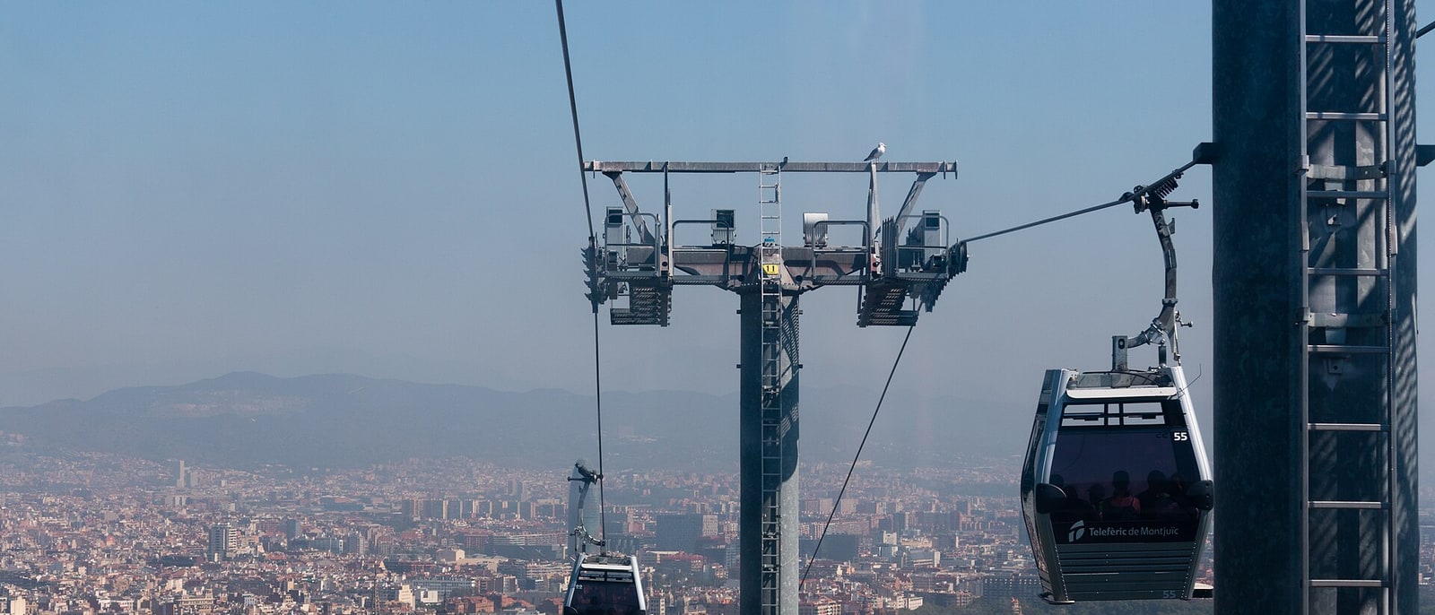 A Montjuïc cable car cabin hanging above the city