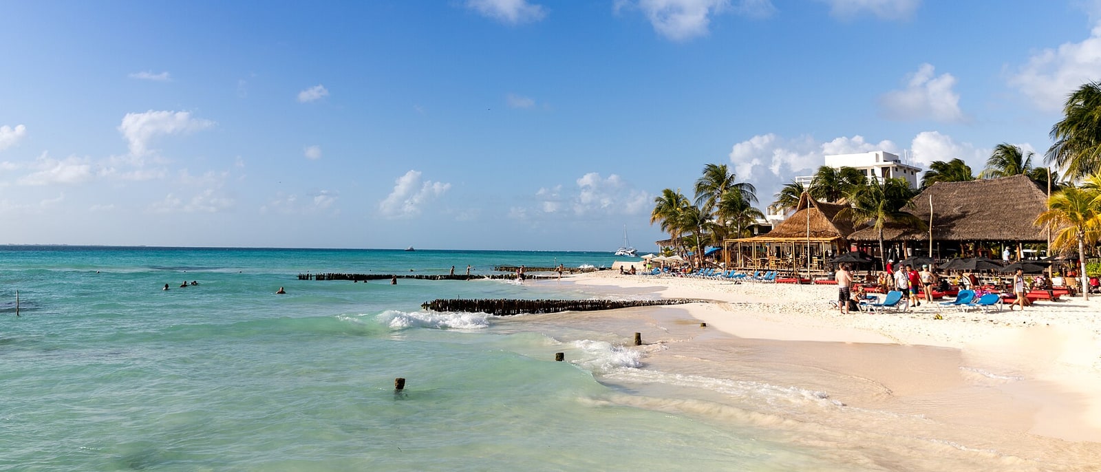 The shore of Isla Mujeres, palapas right on the sand