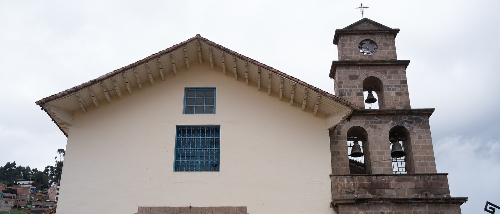 The white church of San Blas, with its stone belfry