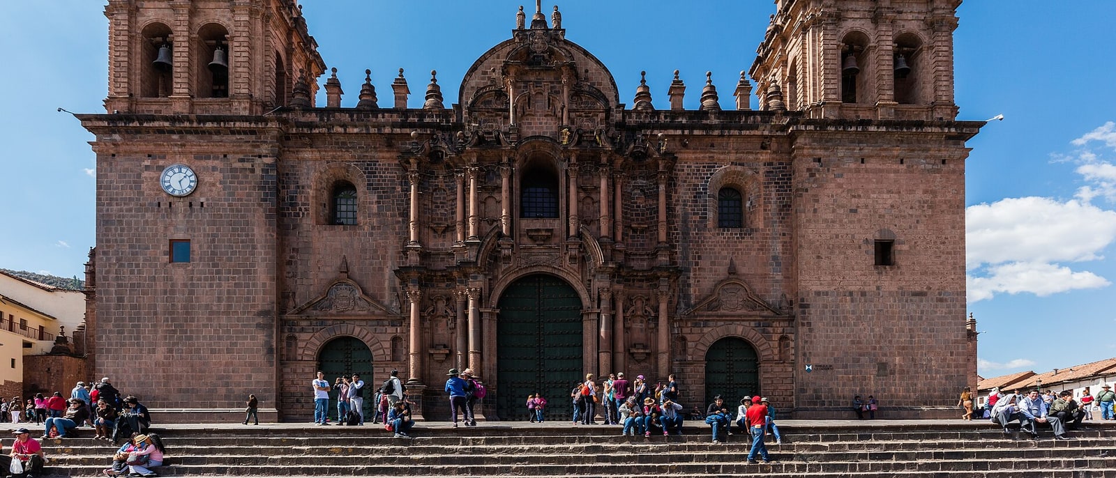 Cusco cathedral on the Plaza de Armas, people on its steps