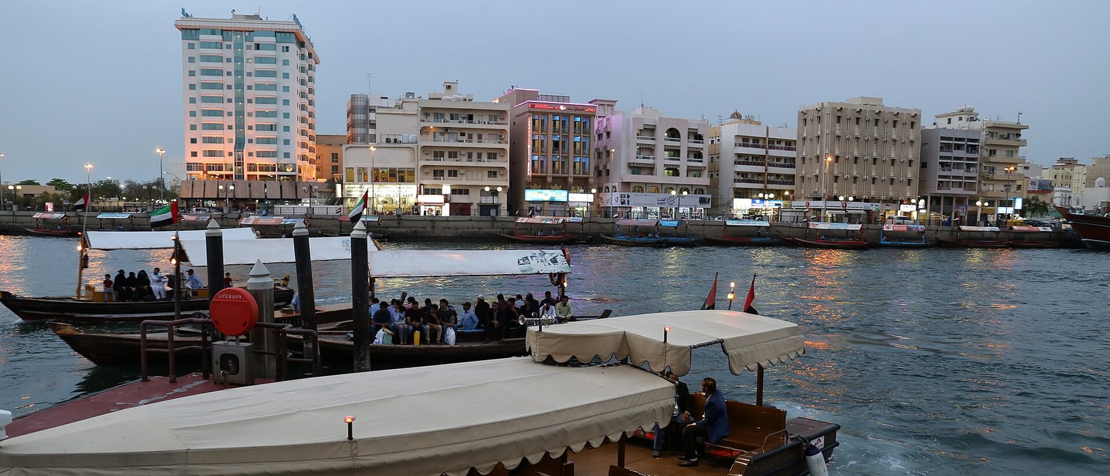 Abras loaded with passengers crossing the Creek
