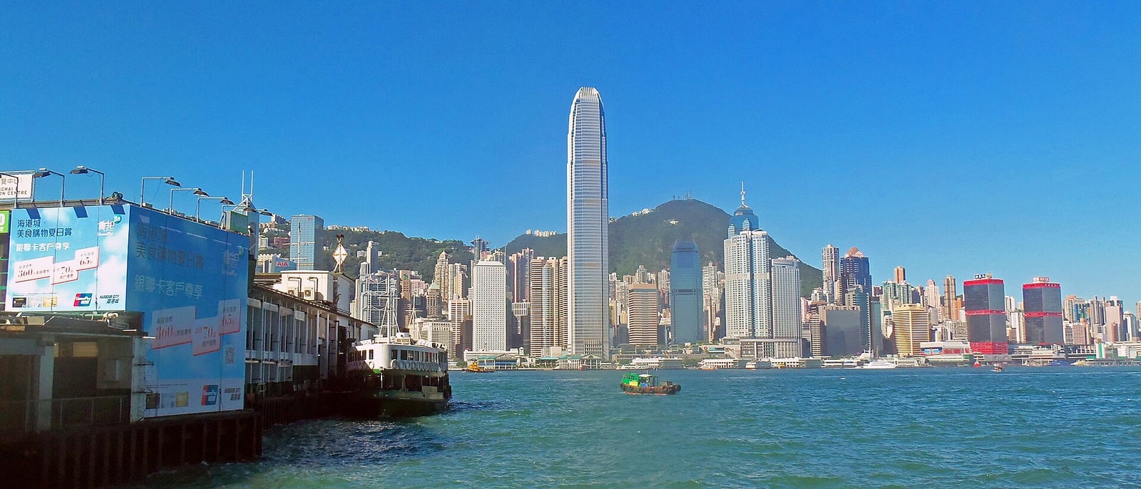 Victoria Harbour with the island’s wall of towers and the peak behind
