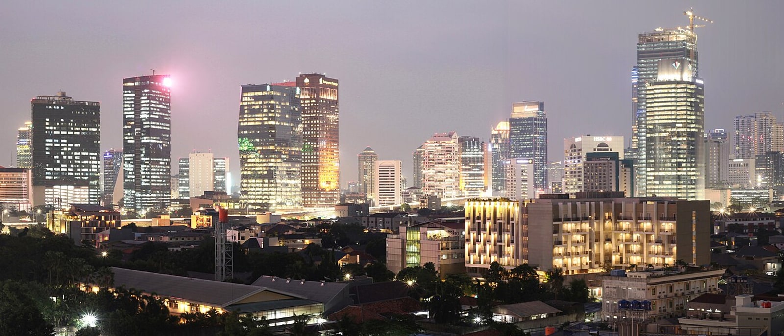The Sudirman towers lit up at night