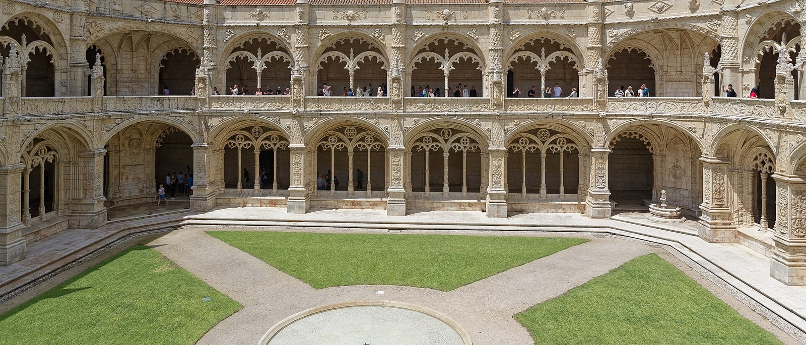 The two-storey cloister of the Jerónimos monastery, its stone carved throughout