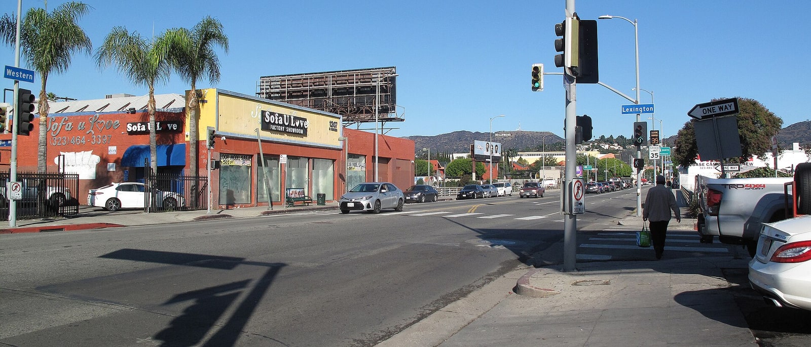 An East Hollywood junction, palms and traffic