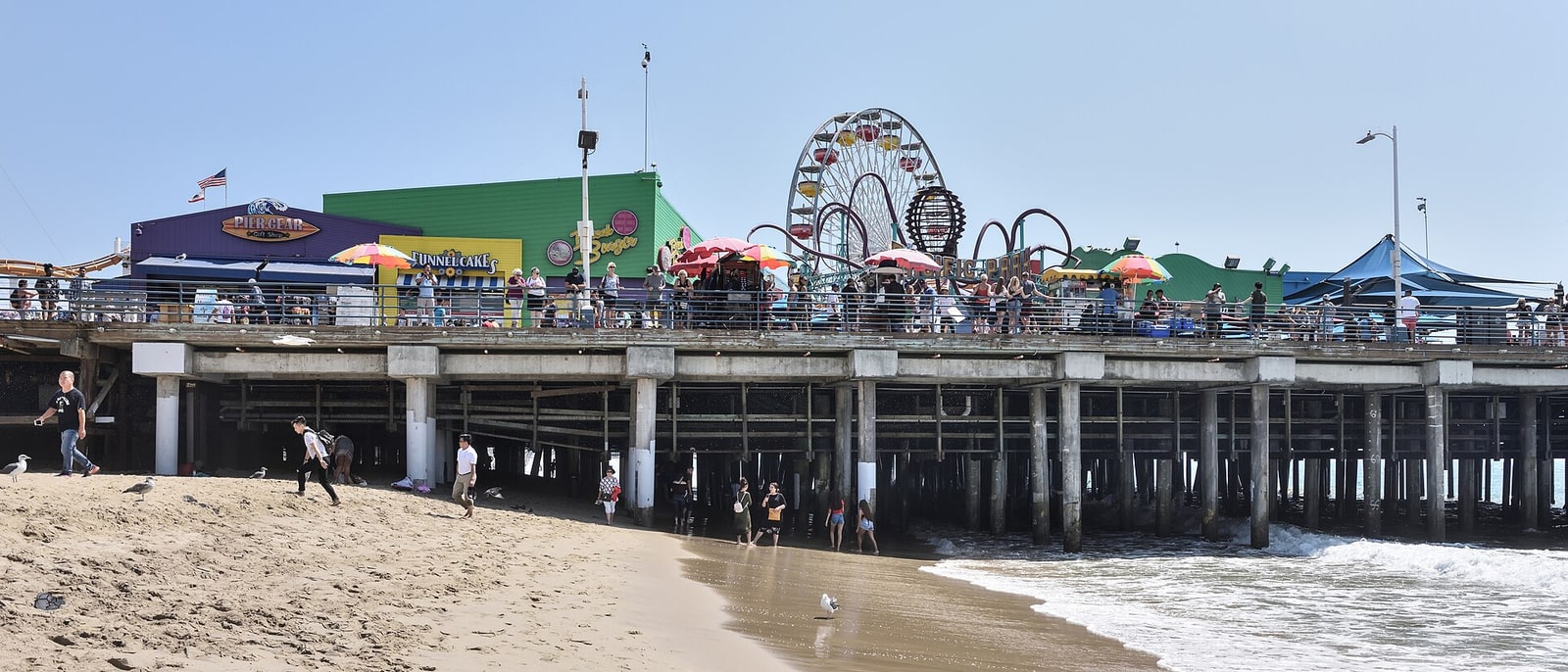 Santa Monica Pier and its Ferris wheel, seen from the beach
