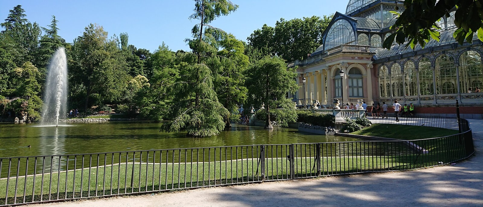The Retiro’s Crystal Palace among the trees, its pond and fountain in front