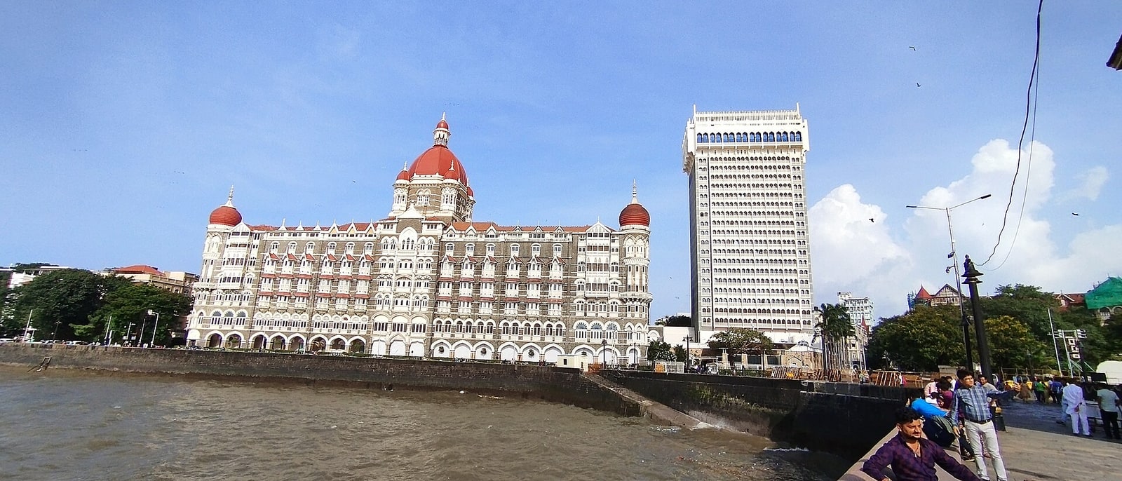 The Taj Mahal Palace hotel by the water, the newer tower beside it