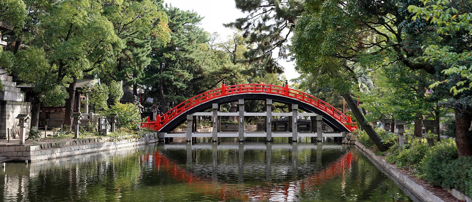The red arched bridge at Sumiyoshi Taisha shrine, reflected in the water