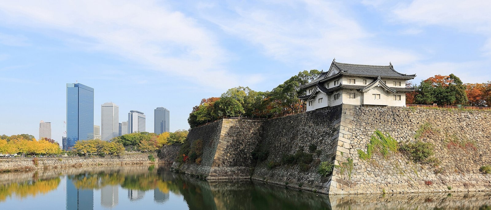 Osaka Castle above its moat, office towers behind