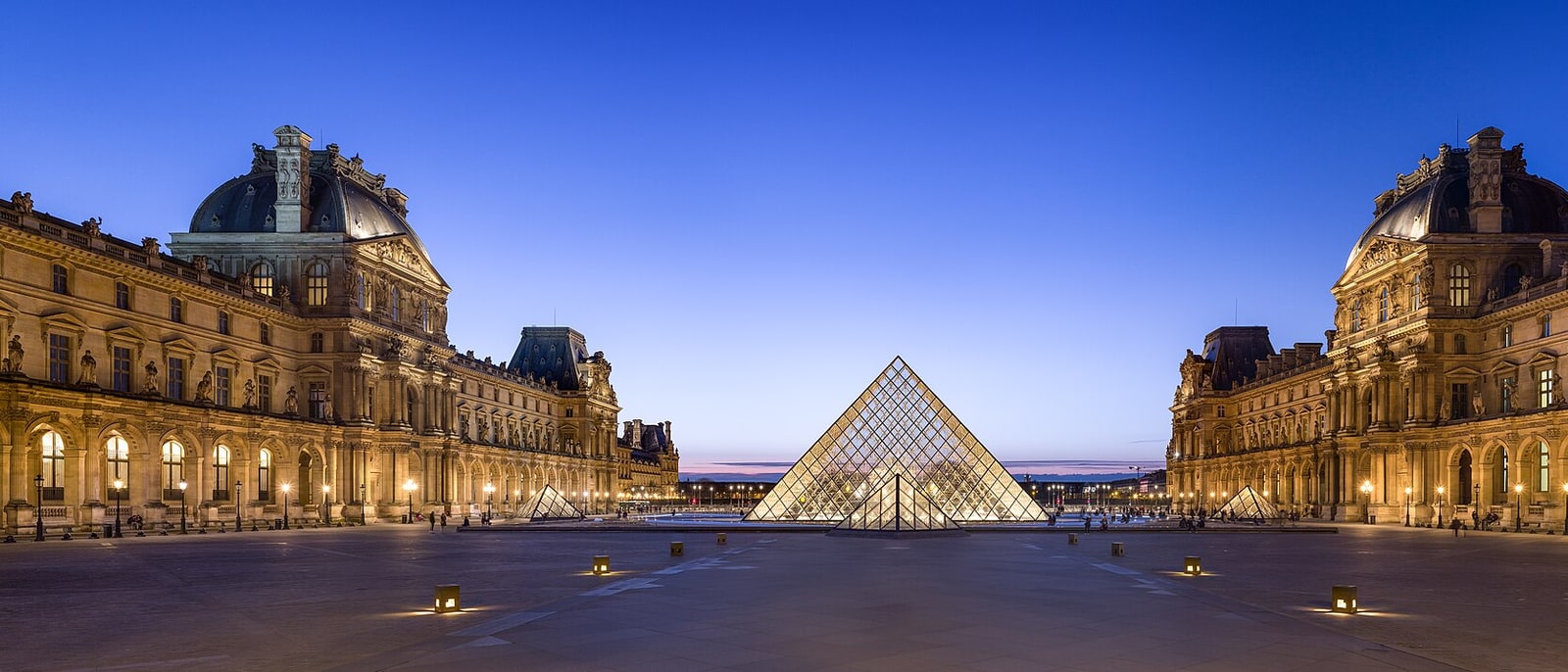 The Louvre courtyard with the glass pyramid at its centre and the palace wings around it