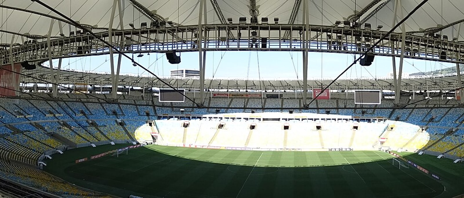 Inside the Maracanã, empty stands and the lit pitch