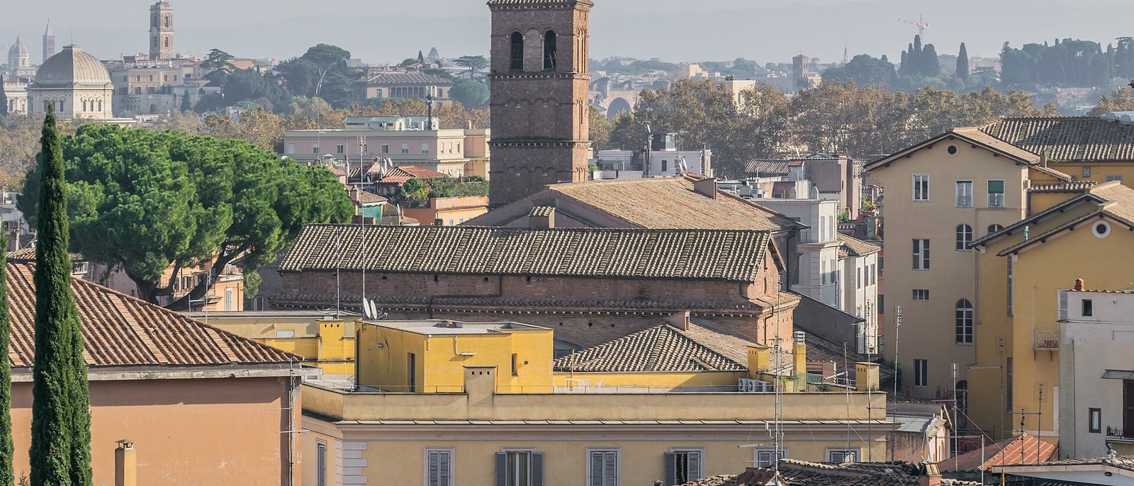 The rooftops of Trastevere with the bell tower of Santa Maria rising among them