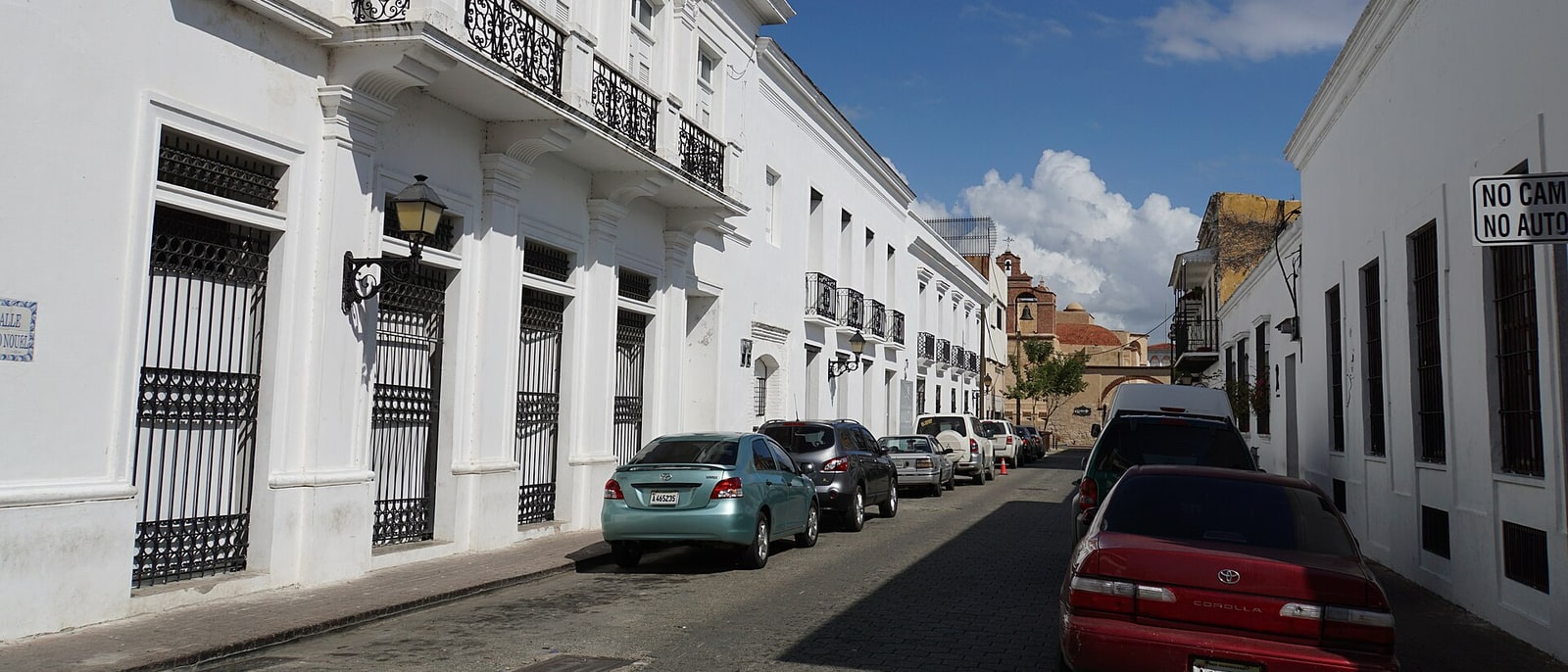 A street in the Colonial Zone, cars parked on both sides
