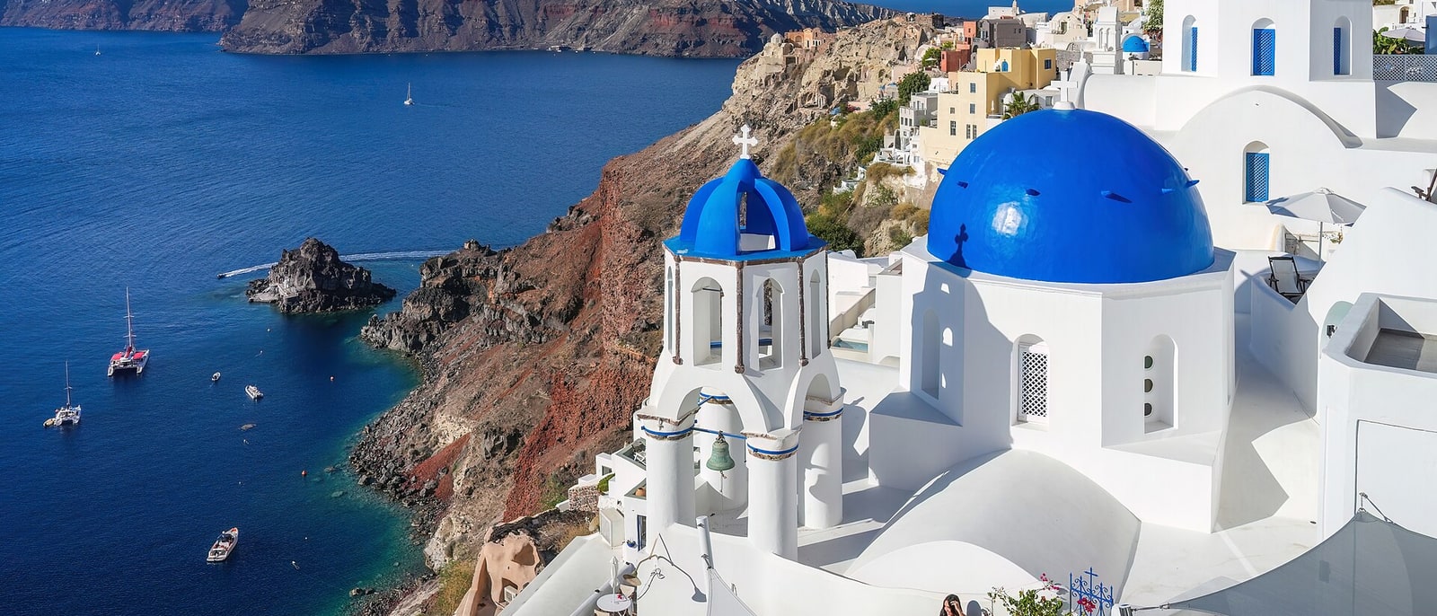 The blue domes of Oia above the caldera