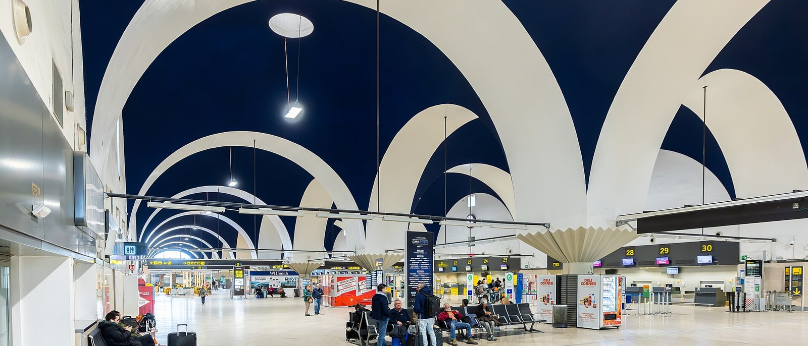 The check-in hall of Seville airport, with Moneo’s blue arches