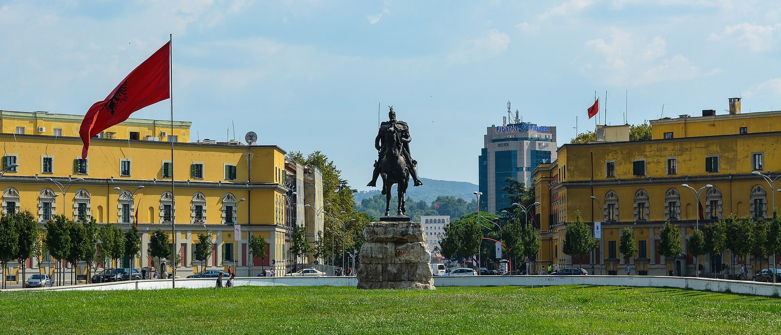 Skanderbeg Square with its equestrian statue and red flags