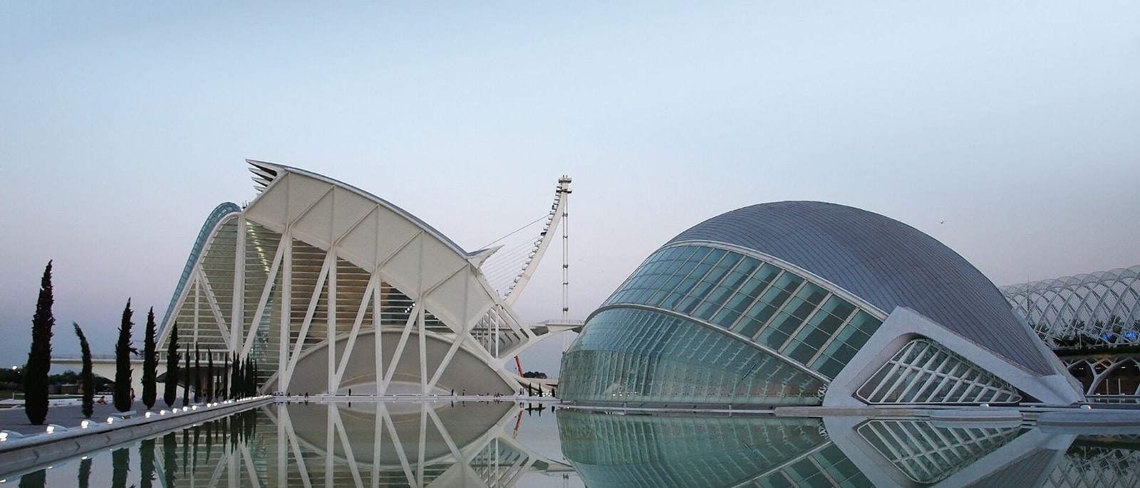 The City of Arts and Sciences at dusk, mirrored in its pools
