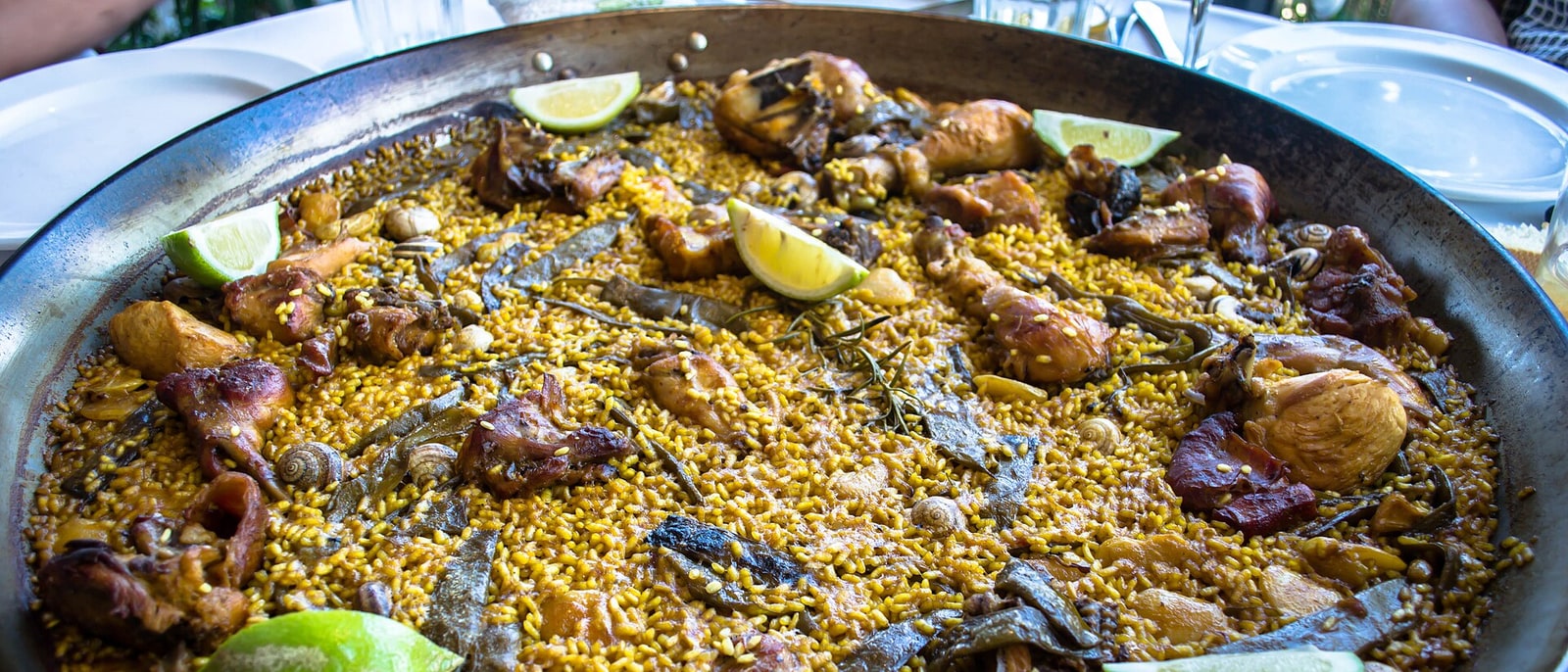 A Valencian paella of chicken and rabbit in the pan: no seafood in sight