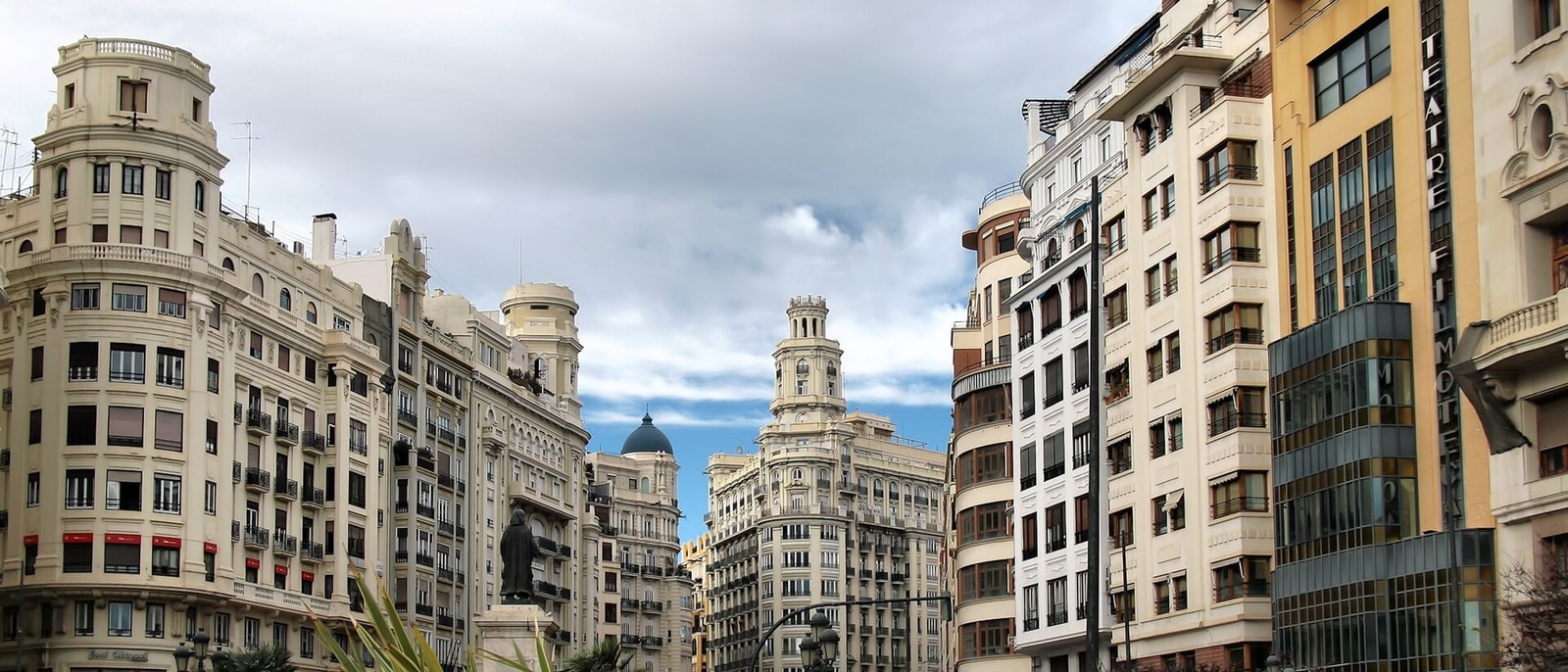 The buildings of Valencia’s town hall square under a cloudy sky