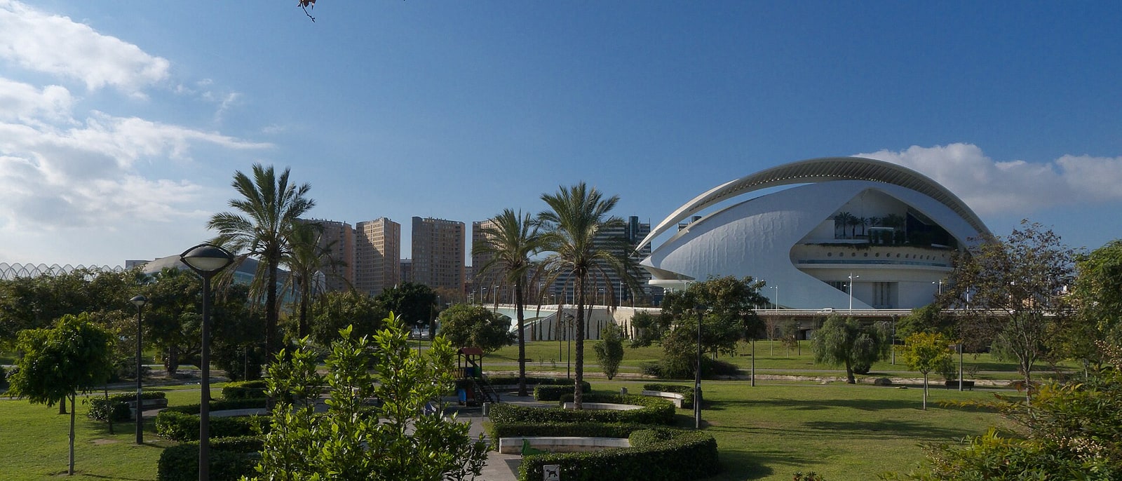 The old Turia riverbed, now gardens, the Palau de les Arts rising behind the trees