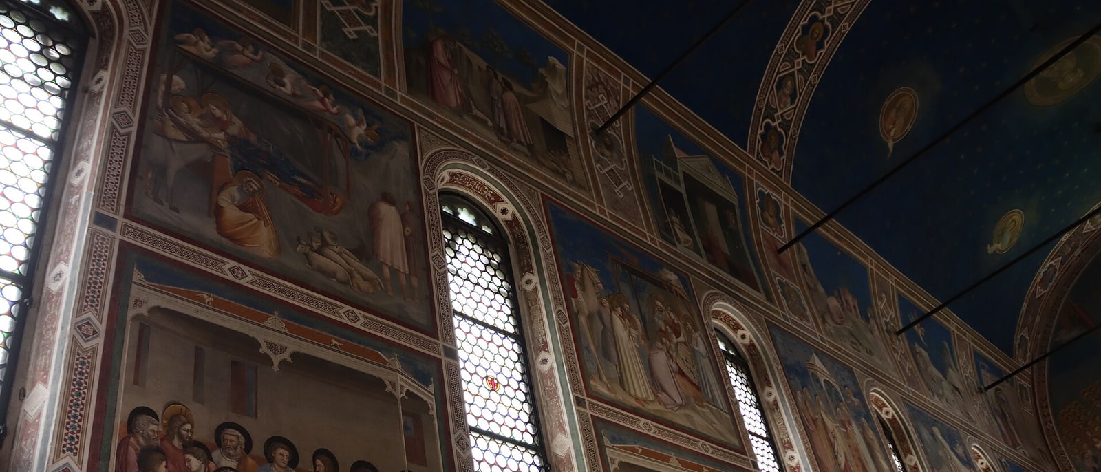 Inside the Scrovegni Chapel in Padua, its blue vault painted by Giotto